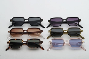 Macro shot of stylish square sunglasses in six color variants with gold arrow temple details