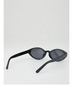 Detail view of oval black vintage sunglasses showing the model number WF12101 on the temple