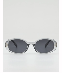 Detail view of small oval grey sunglasses frame with golden star metal accents