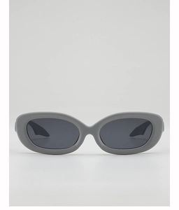 Close-up of trendy dark grey oval sunglasses with thick frames and UV protection lenses