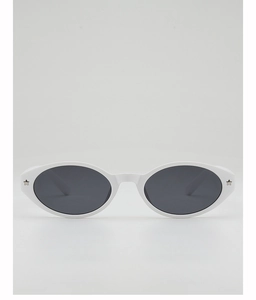 Close-up of white oval frame sunglasses with silver star details and dark lenses