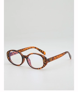 Detailed close-up of tortoise shell oval frame sunglasses with wide temples and metal accents
