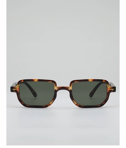 Detail of tortoise shell square sunglasses with golden arrow metal hardware on temple
