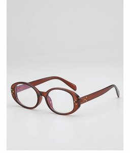 Close-up of amber oval frames with gold star rivets and blue light blocking lenses