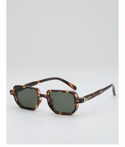 Close-up of retro tortoiseshell square sunglasses with golden metal rivet details