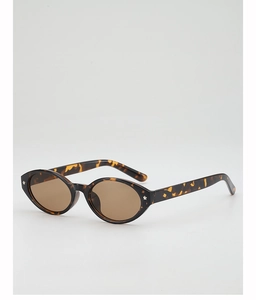 Detail of oval leopard print sunglasses featuring silver star accents and tinted lenses