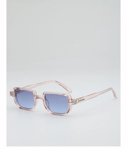 Close-up of translucent pink square frame sunglasses with gold metal hinge detail