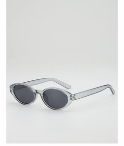 Detailed close-up of oval sunglasses featuring a transparent grey frame and dark lenses