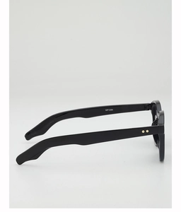 Side profile of round black sunglasses with gold rivet accents and WF1290 model code