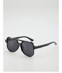 Close-up of geometric double bridge sunglasses with matte black frames and dark gray lenses