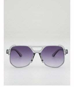 Detail of oversized sunglasses with transparent grey frame and purple gradient lenses