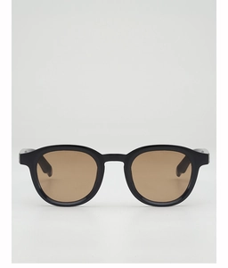 Front view of round black frame sunglasses with brown lenses and thick acetate material
