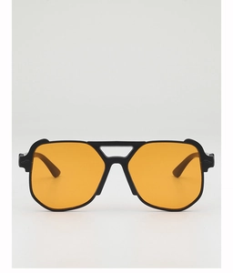 Detail of oversized black sunglasses with orange lenses and unique cat-ear frame design