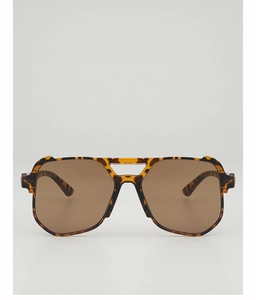 Detailed front view of oversized tortoiseshell sunglasses with double bridge design