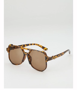 Detailed macro view of retro tortoiseshell sunglasses with double bridge and amber lenses