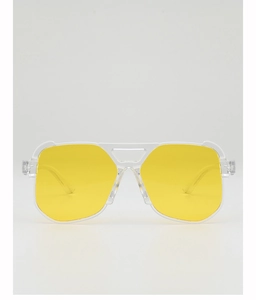 Detail of yellow aviator lenses and transparent plastic frame with double bridge design