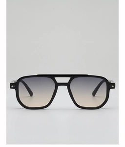 Close-up of black double-bridge aviator sunglasses with gradient lenses and gold arrow hinges