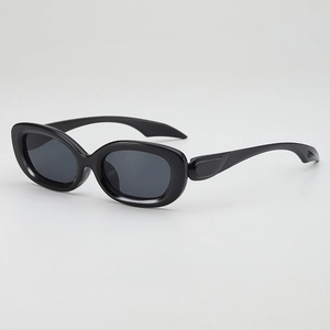 Retro black oval sunglasses with thick frames and dark lenses for millenial fashion style