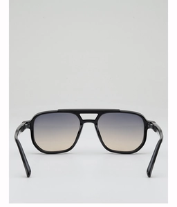 Detail view of the black aviator frame with grey and amber gradient lenses and double bridge