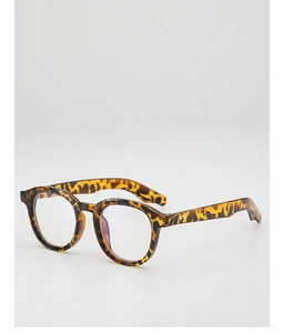 Detail of round leopard tortoise frame glasses with vintage golden rivet accents