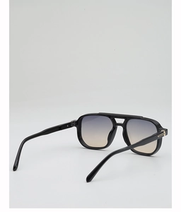 Detail view of double bridge black aviator sunglasses with gradient lenses and T-shaped metal hinges