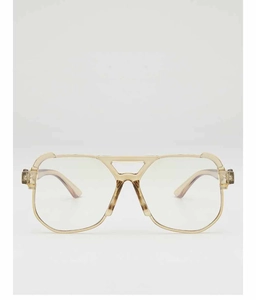 Close-up of retro aviator sunglasses with gold frames and tortoiseshell temple detail