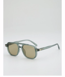 Close-up of matte translucent gray-green sunglasses with retro double bridge and gold hinges