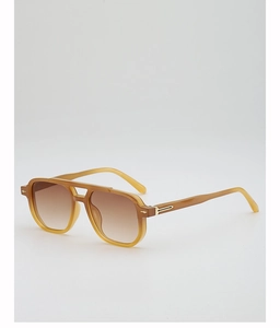 Detail of vintage pilot sunglasses with translucent champagne frames and gradient lenses