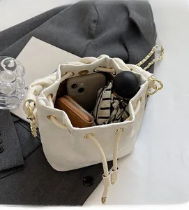 Top view of white drawstring bucket bag interior showing spacious daily storage capacity