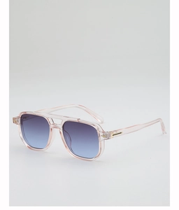 Detail of pink transparent aviator sunglasses with blue gradient lenses and gold metal hinge