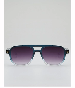 Close-up of pilot sunglasses with blue gradient frames and gold diamond metal accents