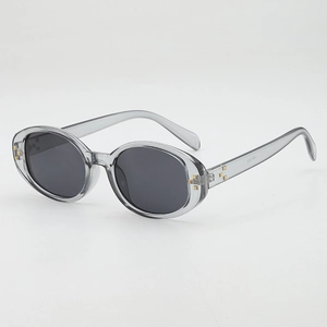 2025 oval small frame sunglasses in transparent grey with floral metal accents