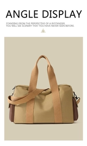 Vue de face du sac en toile kaki avec garniture en cuir marron et larges sangles