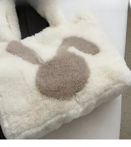 Detailed view of the soft faux fur texture and cute rabbit ear pattern on the tote bag
