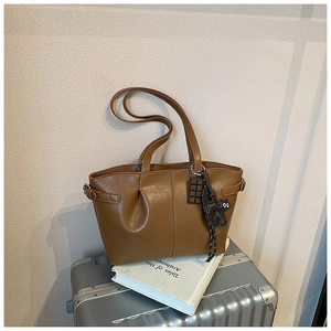 Brown pleated PU leather tote bag detail with decorative cat and chocolate charms