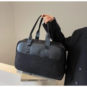 Black canvas and leather business tote bag with a minimalist large-capacity design