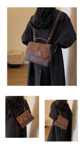 Detail of retro checkered backpack showing brown leather texture and gold hardware accents
