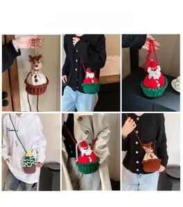 Model wearing mini crochet Christmas crossbody bags featuring Santa and reindeer designs