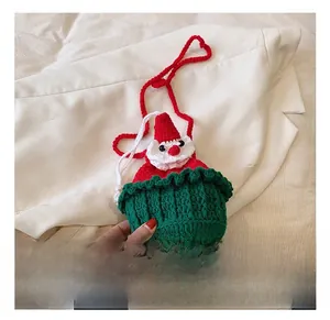 Detail showing the festive handmade knit texture of the Santa Claus themed shoulder bag