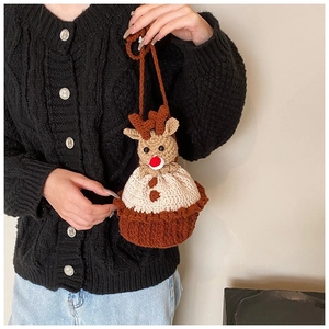 Detail of handmade crochet reindeer bucket bag with 3D deer antlers and a red nose
