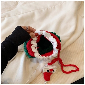 Handmade crochet Christmas drawstring shoulder bag with festive doll pendant for women