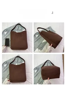 Detail view showing front, side and bottom of brown suede bucket bag with sturdy handle