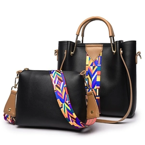 Close-up of PU leather tote and crossbody bag set with colorful ethnic pattern straps
