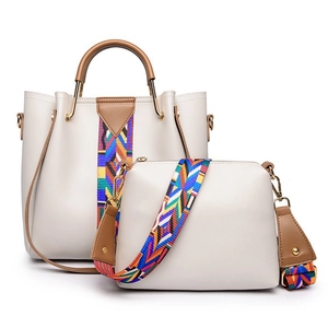 Detail of cream PU tote and crossbody bag set with colorful wave patterned straps