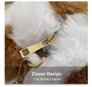 Detail of premium gold metal zipper and lobster clasp on plush faux fur crossbody bag