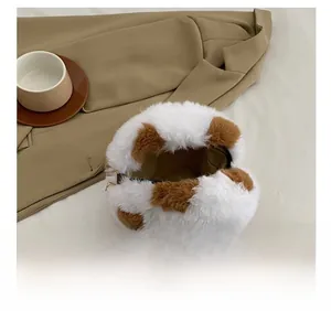 Detail view of the plush crossbody bag interior with zipper and soft leopard pattern