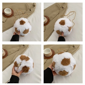Detailed close-up of spherical faux fur crossbody bag with spotted pattern and chain strap