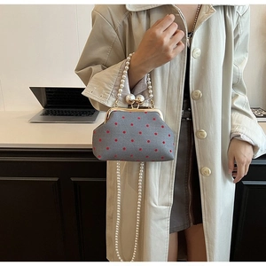 Vintage gray kiss-lock bag with red dots, pearl handle and pearl crossbody chain