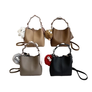 Set of four minimalist faux leather bucket bags in khaki, brown, grey, and black colors
