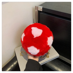 Furry red round crossbody bag with pink heart patterns and gold chain strap